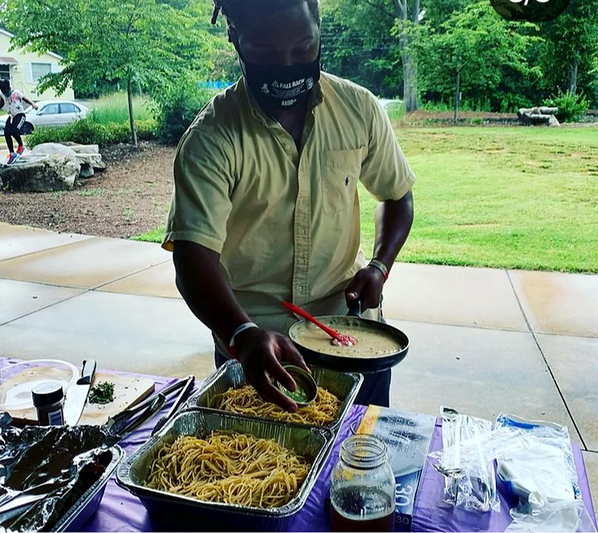 Serving a freshly prepared meal at a community gathering